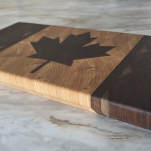 End grain cutting board featuring black walnut maple leaf