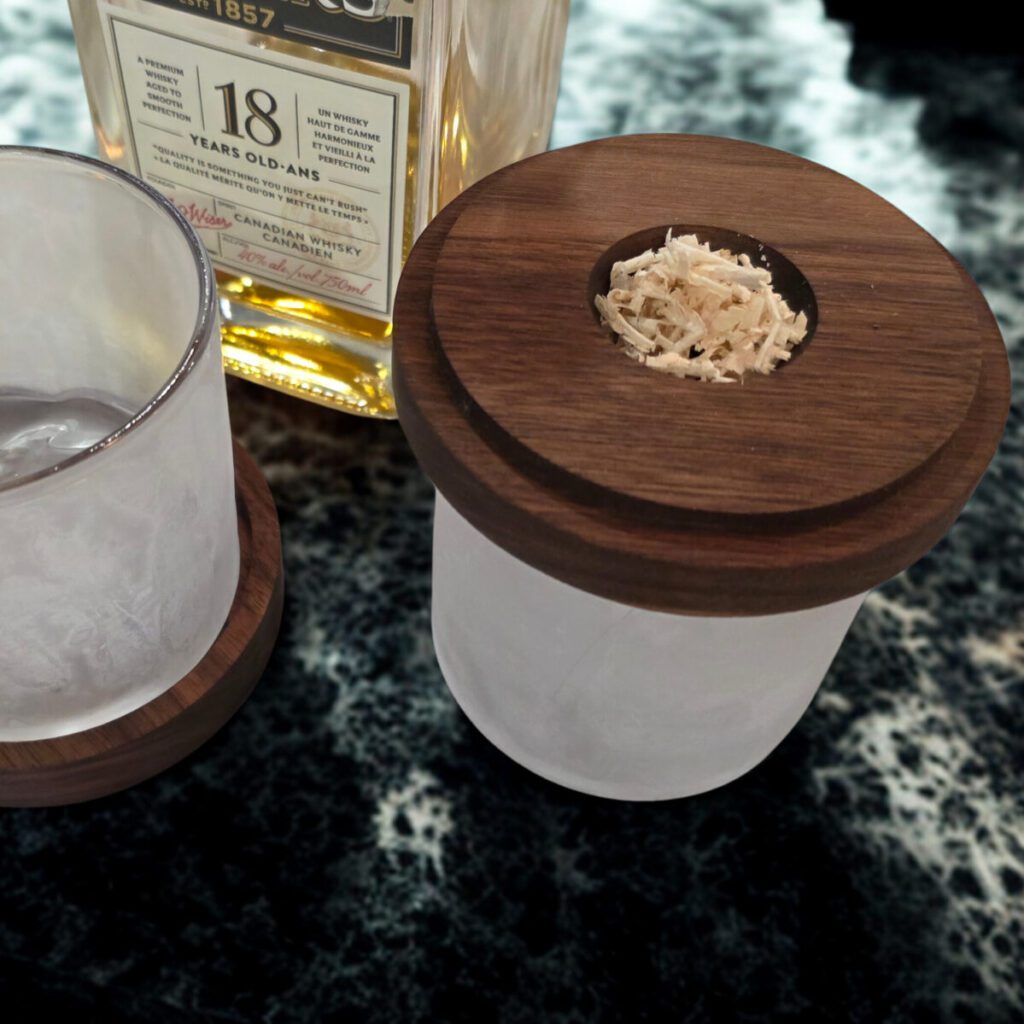 Whiskey Smoker Kit on a bar top with frosted glasses