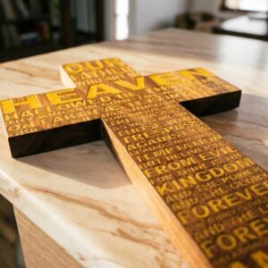 The loads prayer on a cross laying on a marble counter
