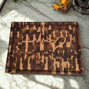 Large wooden cutting board displayed on marble kitchen island