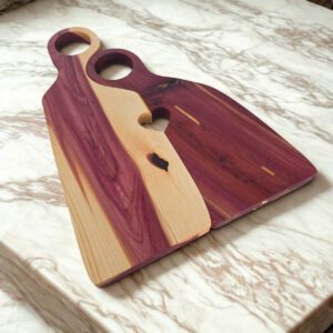 Handcrafted cedar charcuterie board showing natural grain and handle detail