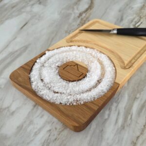 Hickory cocktail prep board on marble counter